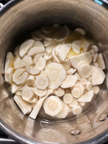 Parsnips, butter and water in saucepan.