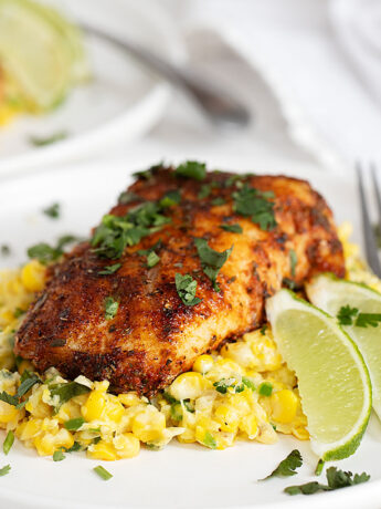 blackened cod on plate with creamed corn
