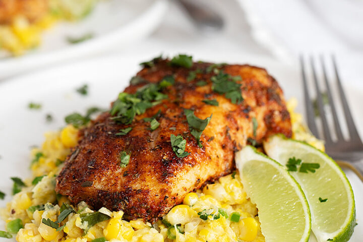 blackened cod on plate with creamed corn