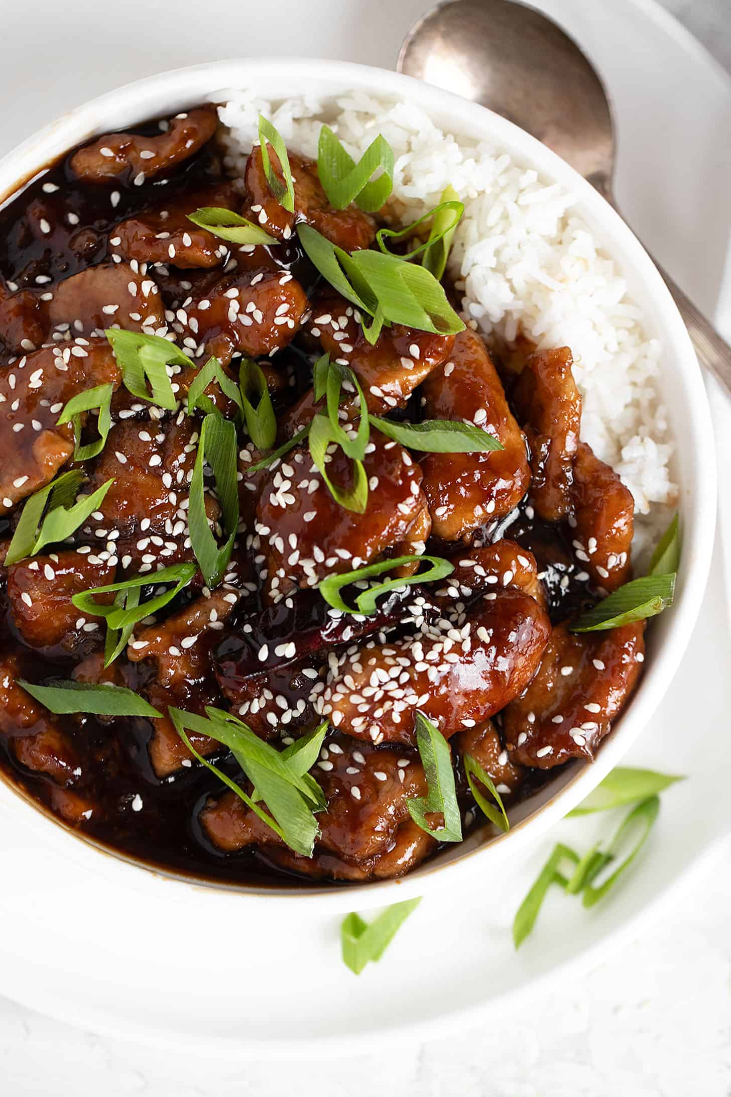 Mongolian pork in bowl with rice