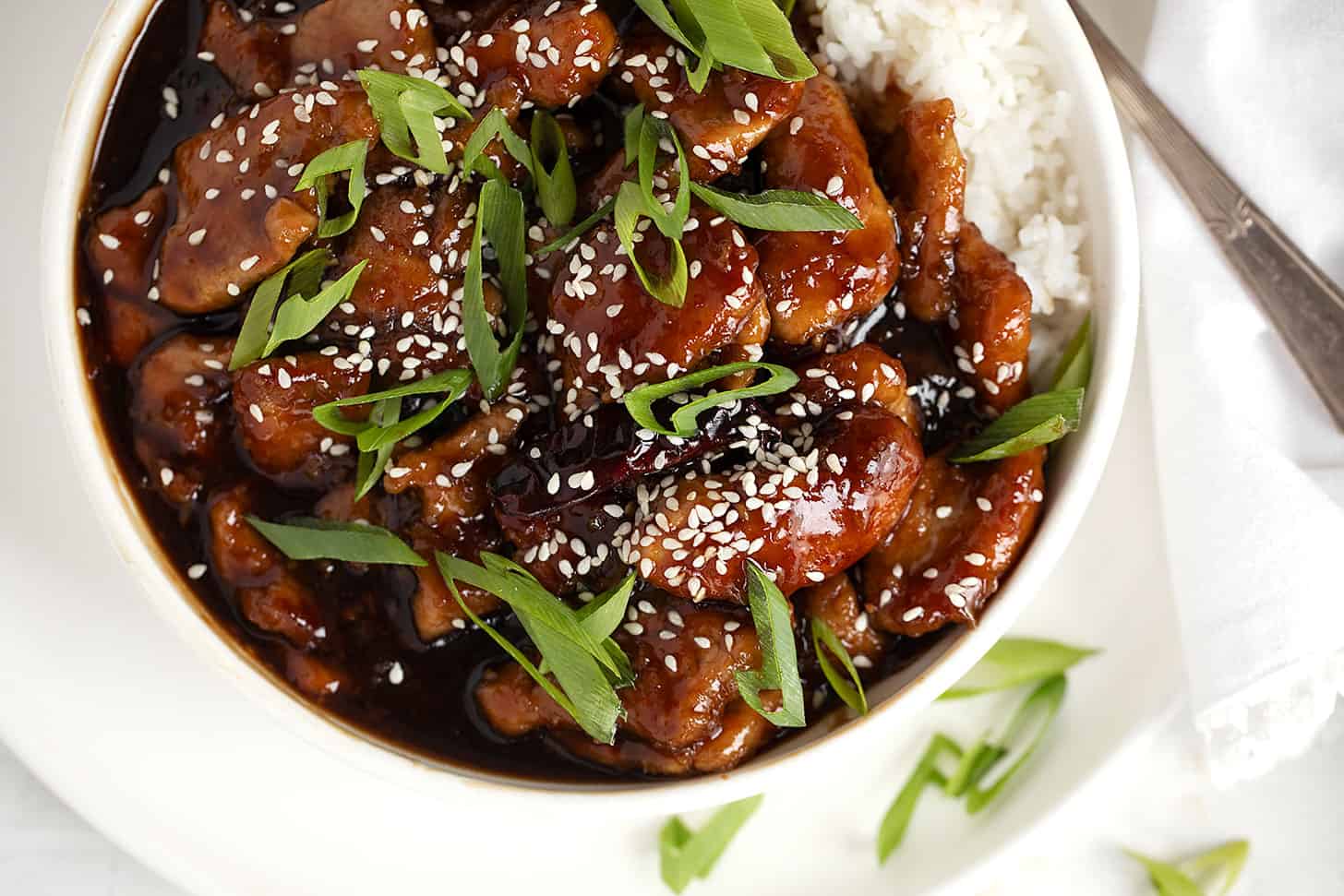 Mongolian pork in bowl with rice