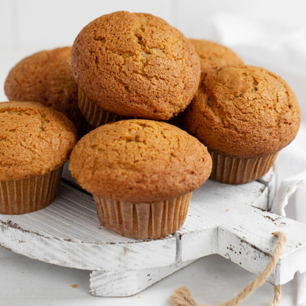 pumpkin muffins on white serving board