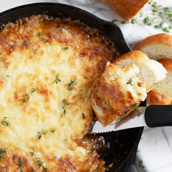 warm brie dip in cast iron skillet with bread