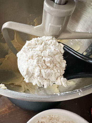 adding the flour mixture to the dough