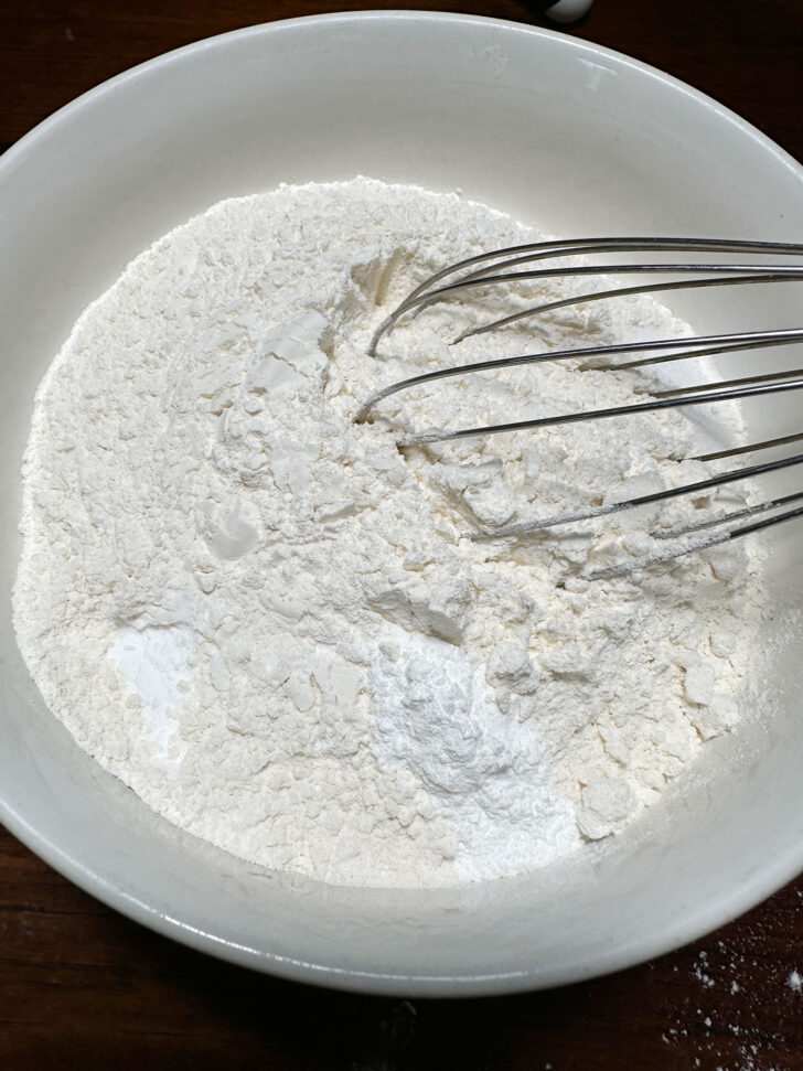 whisking dry ingredients together in a bowl
