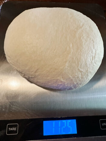 weighing dough on scale