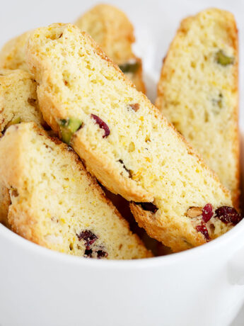 cranberry orange biscotti in large coffee cup