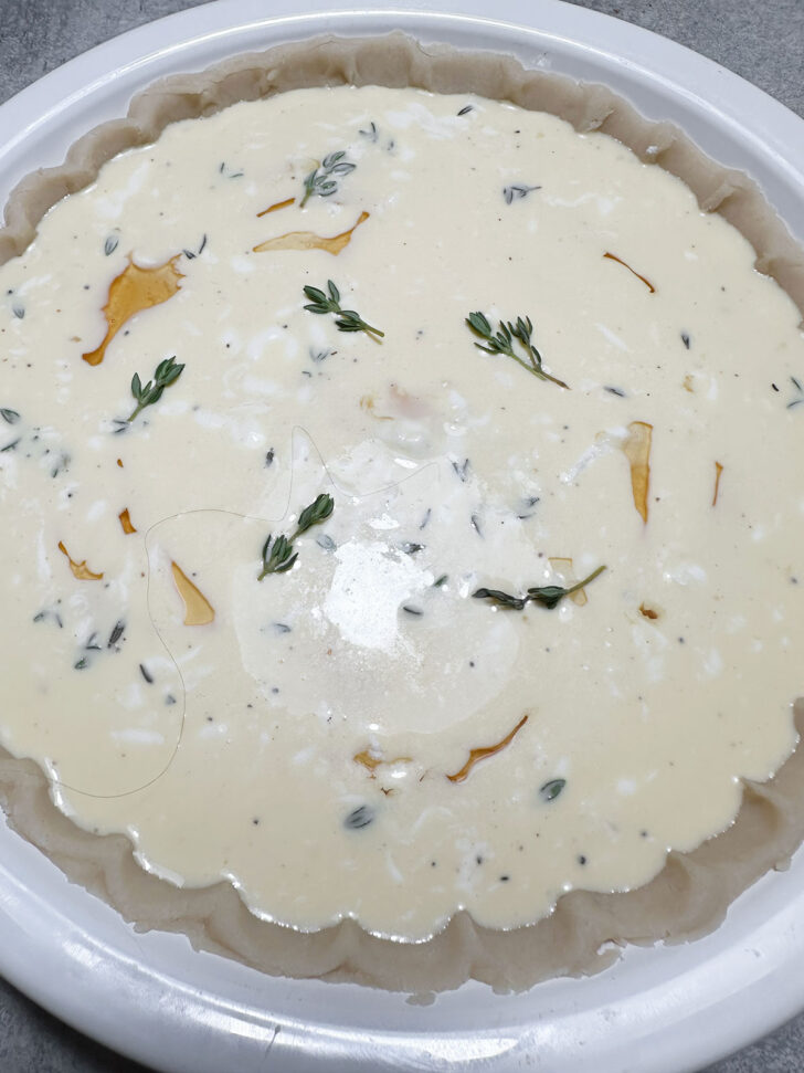 adding a few thyme leaves to the top of the pie before baking