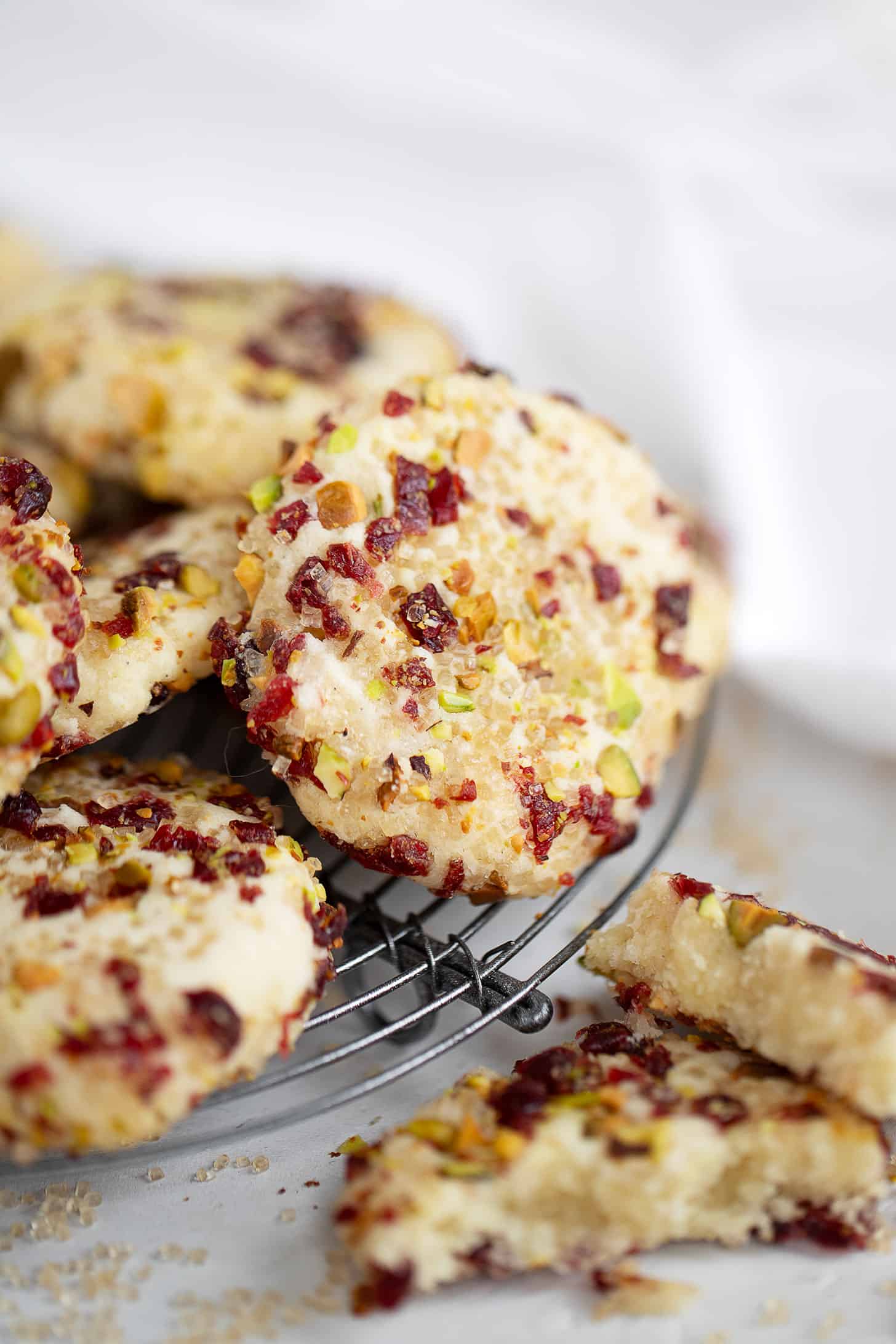 pistachio cranberry crusted shortbread cookies on rack