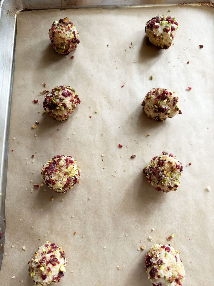 crusted dough balls on baking sheet
