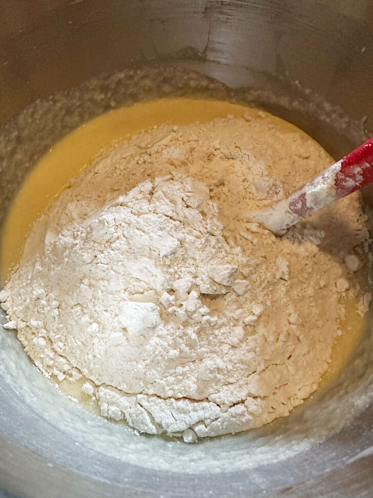 Adding the flour mixture to the batter.