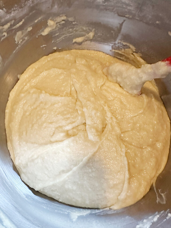 Folding in the flour with a spatula.