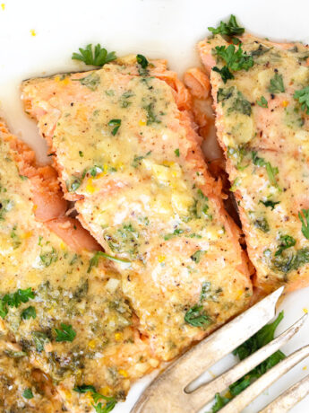 garlic mustard salmon on white plate