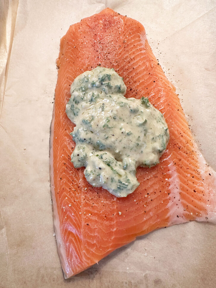 topping spooned on top of salmon 