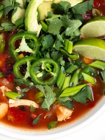 Mexican chicken soup in white bowl