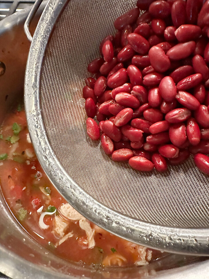 adding kidney beans to the pot