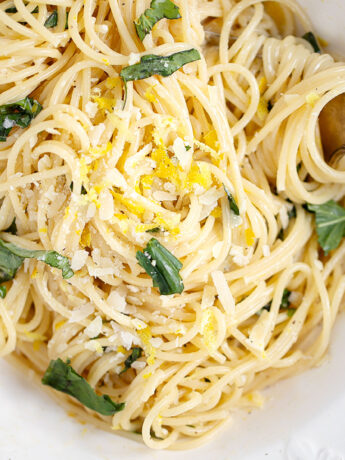 Lemon cream pasta in white bowl.