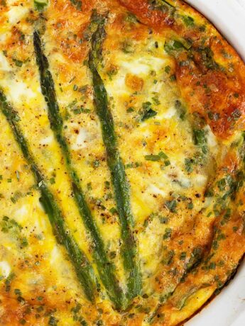 Crustless asparagus quiche in pie dish.