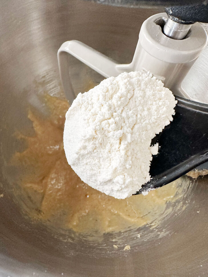 Adding flour mixture to the batter.