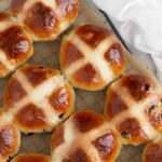 Traditional hot cross buns on cooling rack.