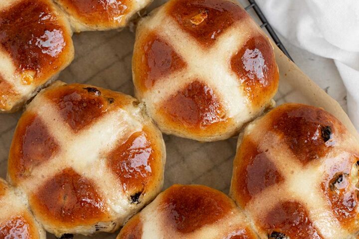Traditional hot cross buns on cooling rack.