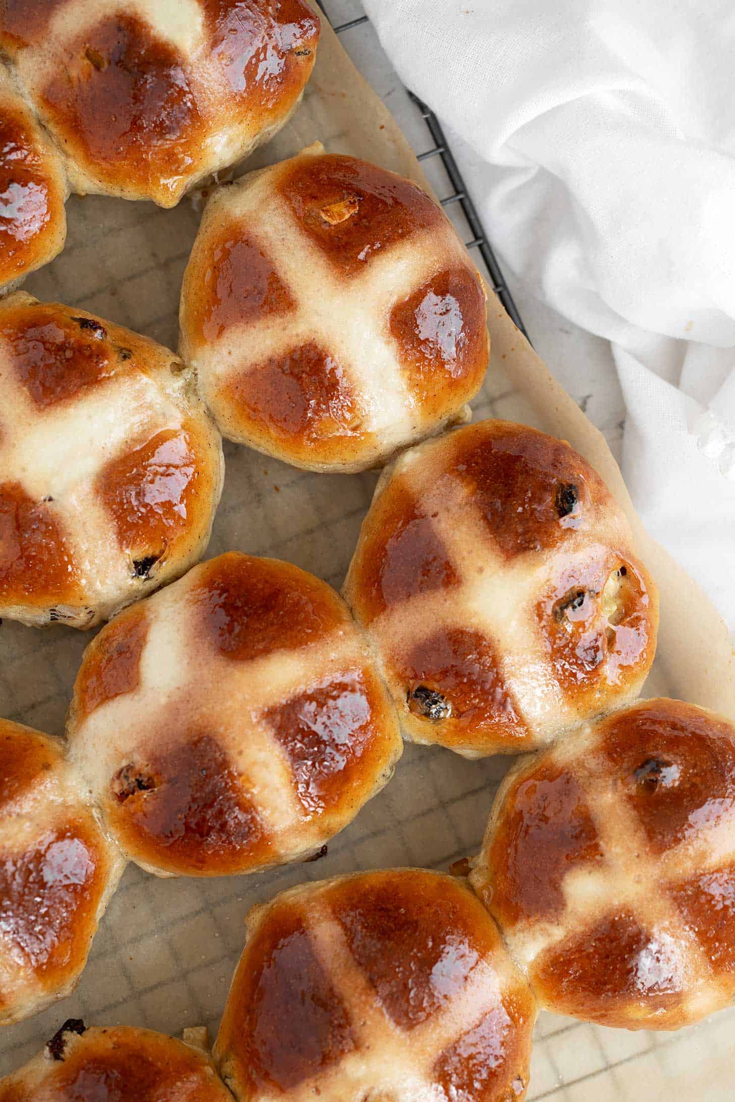Traditional hot cross buns on cooling rack.