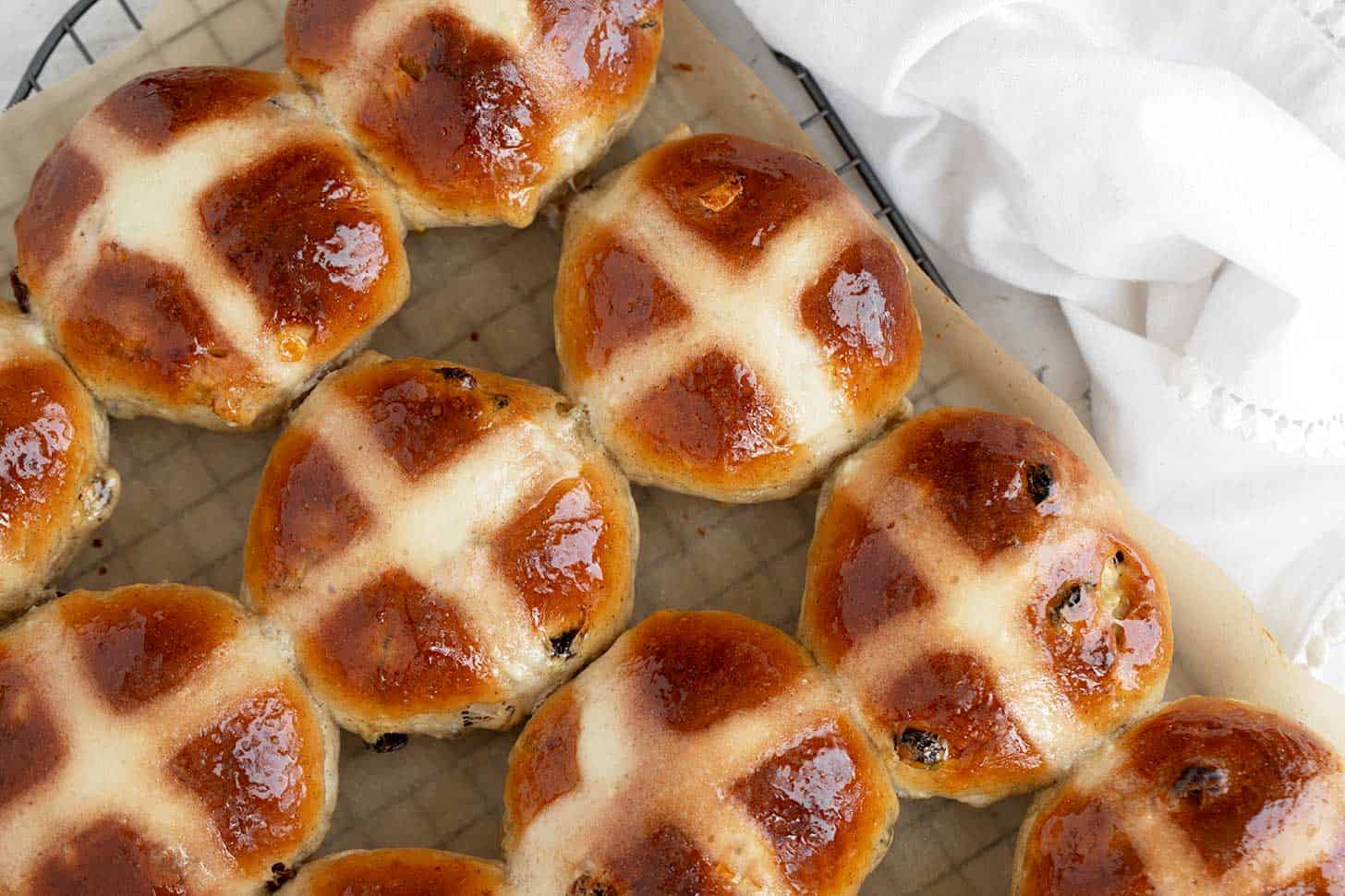 Traditional hot cross buns on cooling rack.