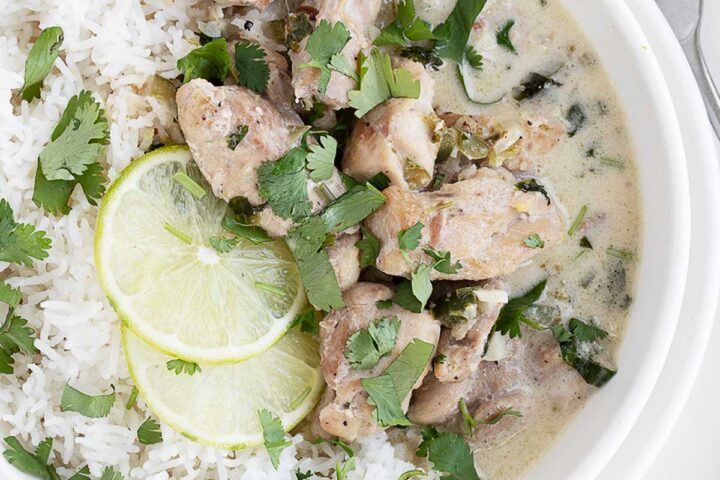 Coconut lime chicken in bowl with rice.