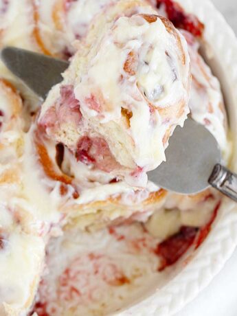 Strawberry cinnamon rolls in baking dish.