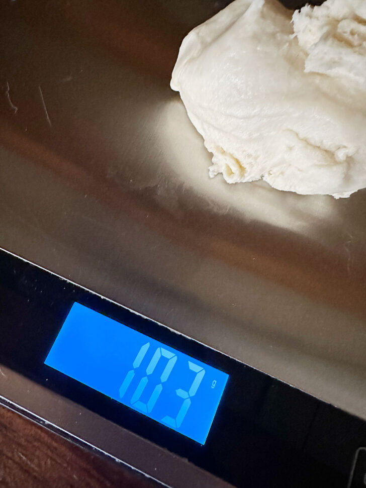 Weighing out the dough balls.