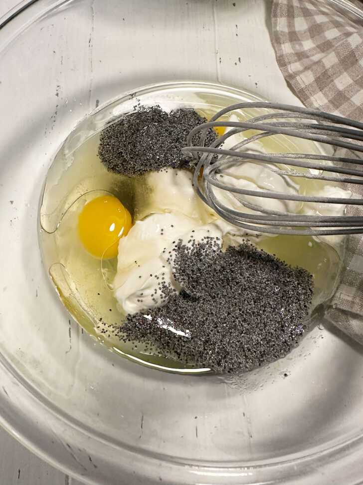 Wet ingredients in a bowl with a whisk.