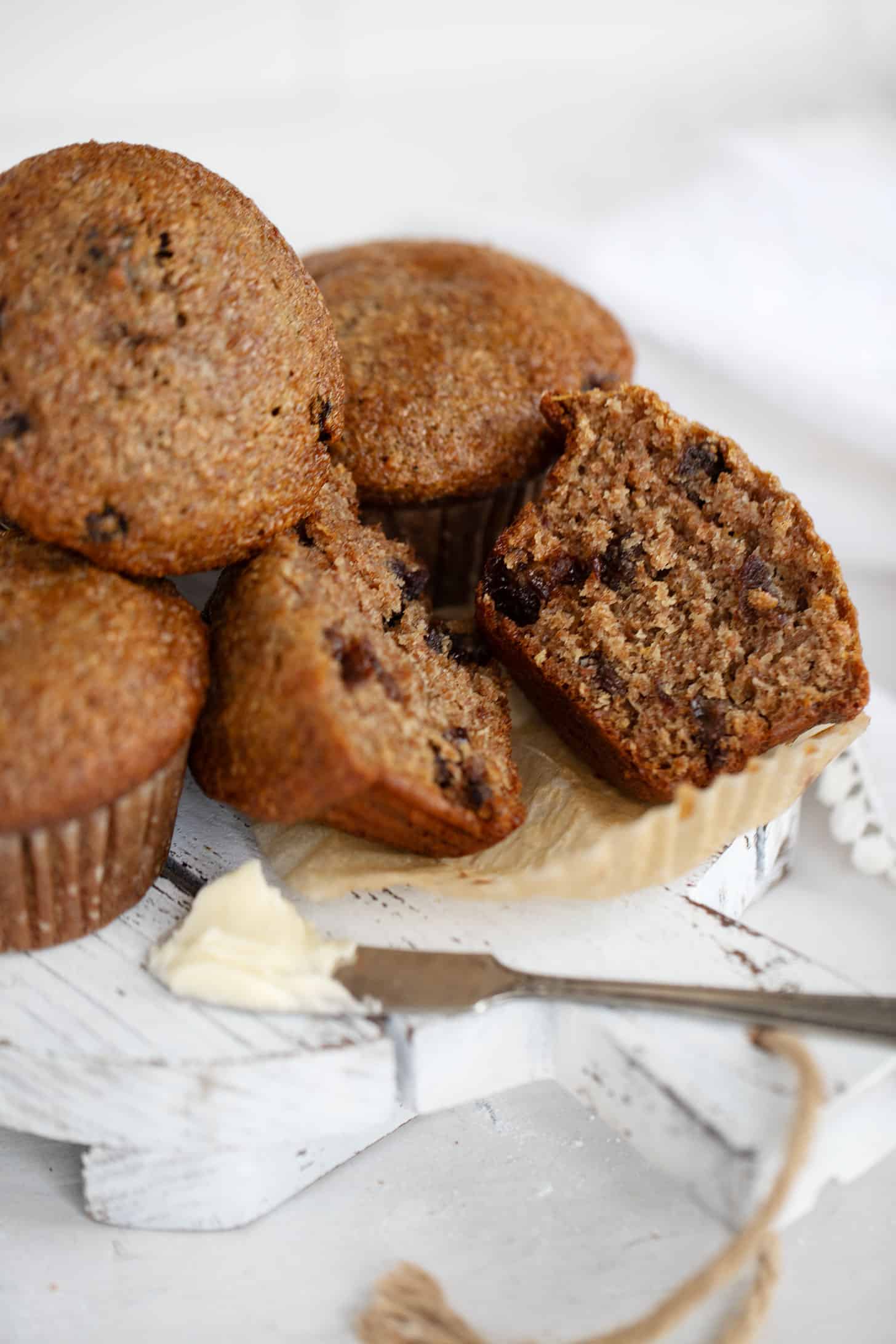 Buttermilk bran muffins sliced on board.