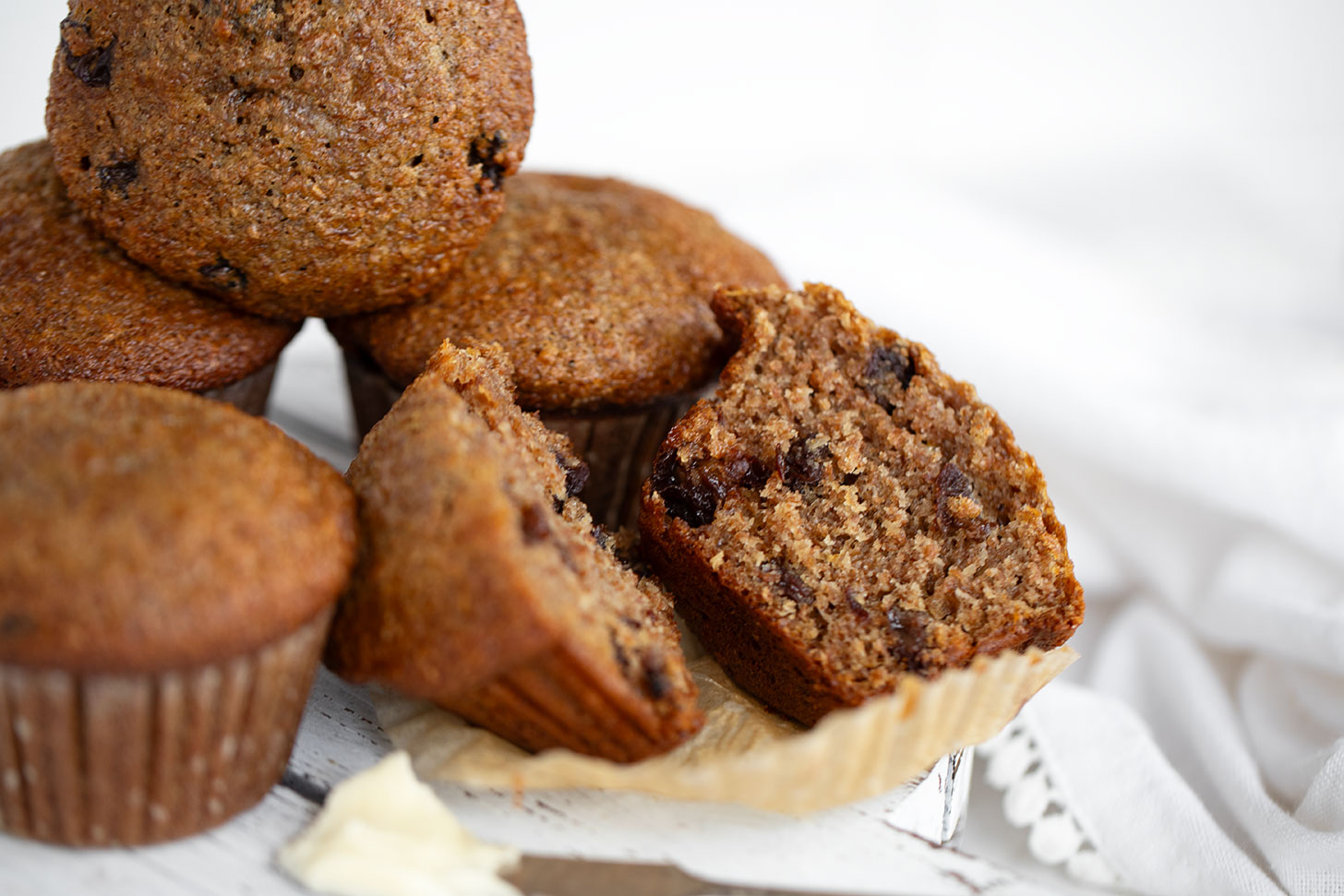 Buttermilk bran muffins sliced on board.