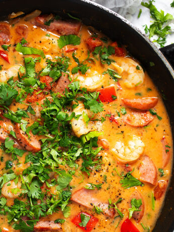 Cajun shrimp and sausage in skillet.