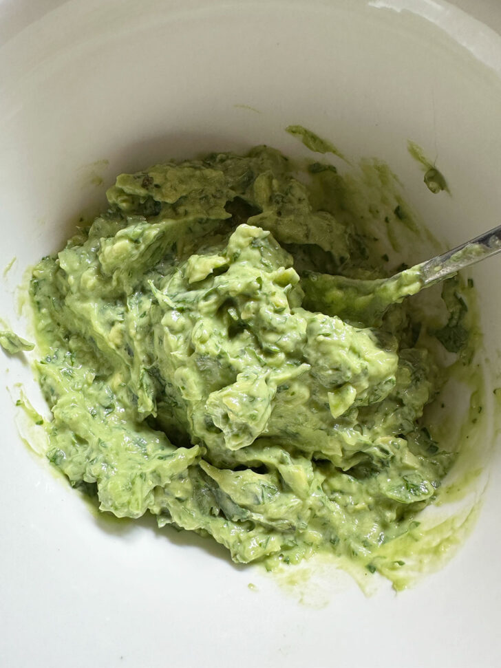 Finished avocado sauce in bowl.