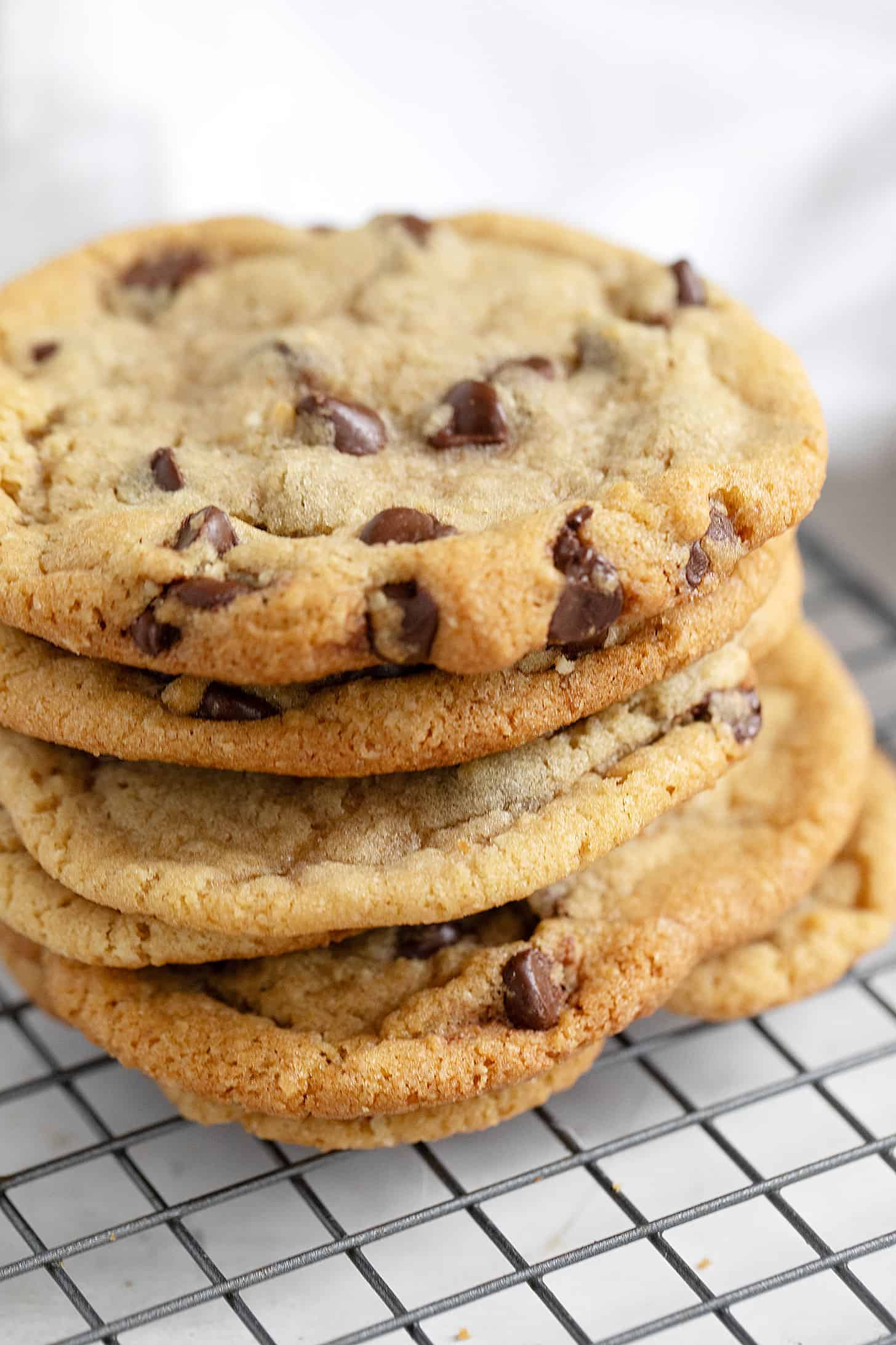 Brown butter chocolate chip cookies on cooling rack.
