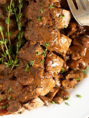 Pork tenderloin Diane on serving plate.