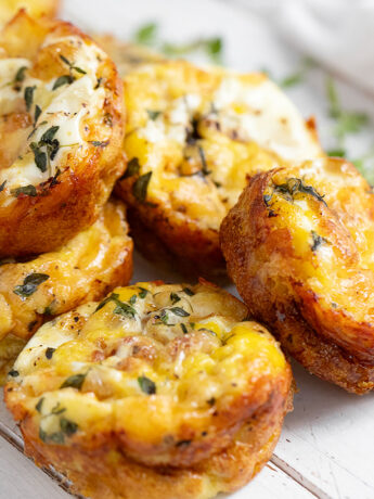 Crustless mini quiche on serving board.