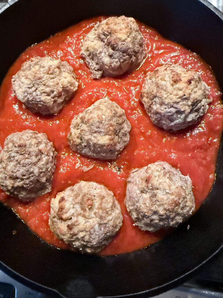 Meatballs added to skillet.