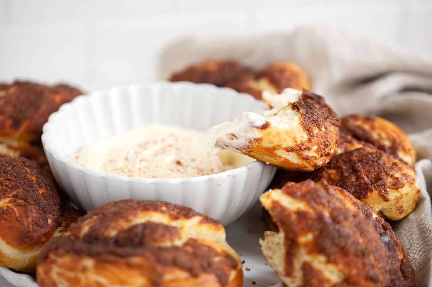 Cinnamon crunch soft pretzels served with a sweet cream cheese dip.