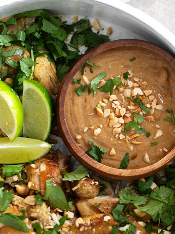 Coconut chicken with peanut sauce in serving bowl.