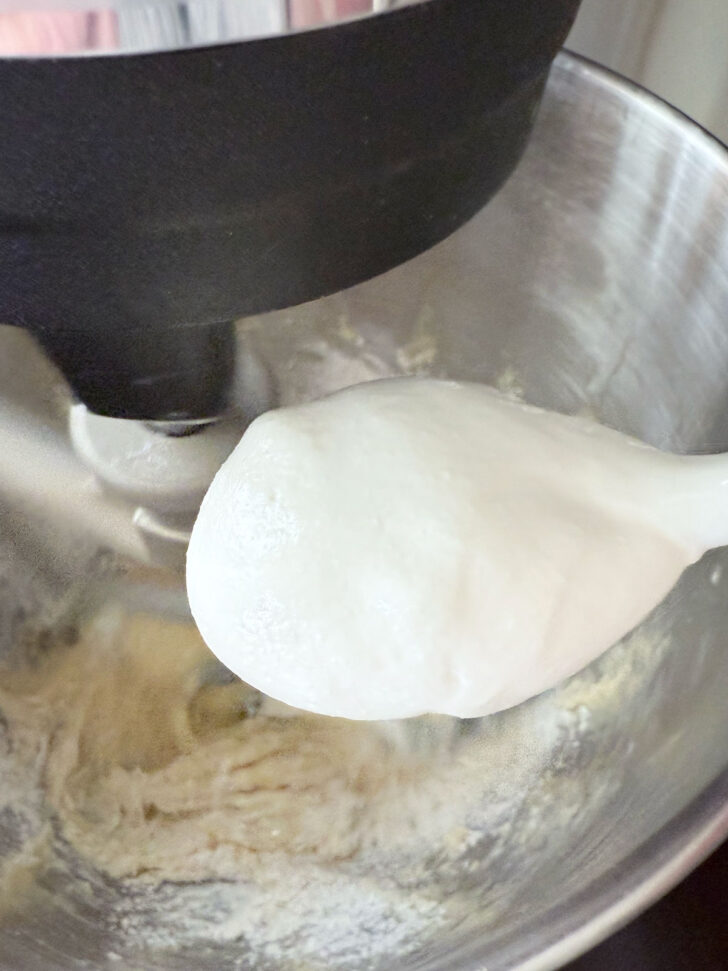 Adding the sour cream to the batter.