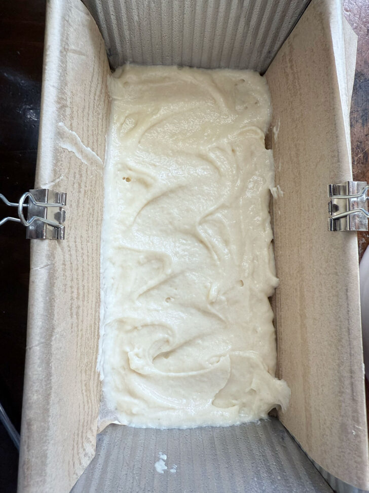 A layer of batter added to the loaf pan.