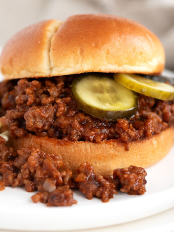 Sloppy Joes on brioche bun with sweet pickles.