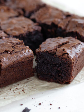 Chocolate brownies on parchment paper.