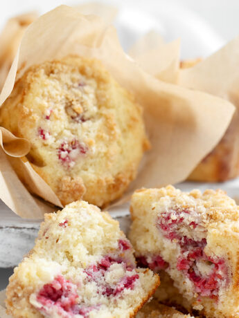 Raspberry lemon muffins on serving board.