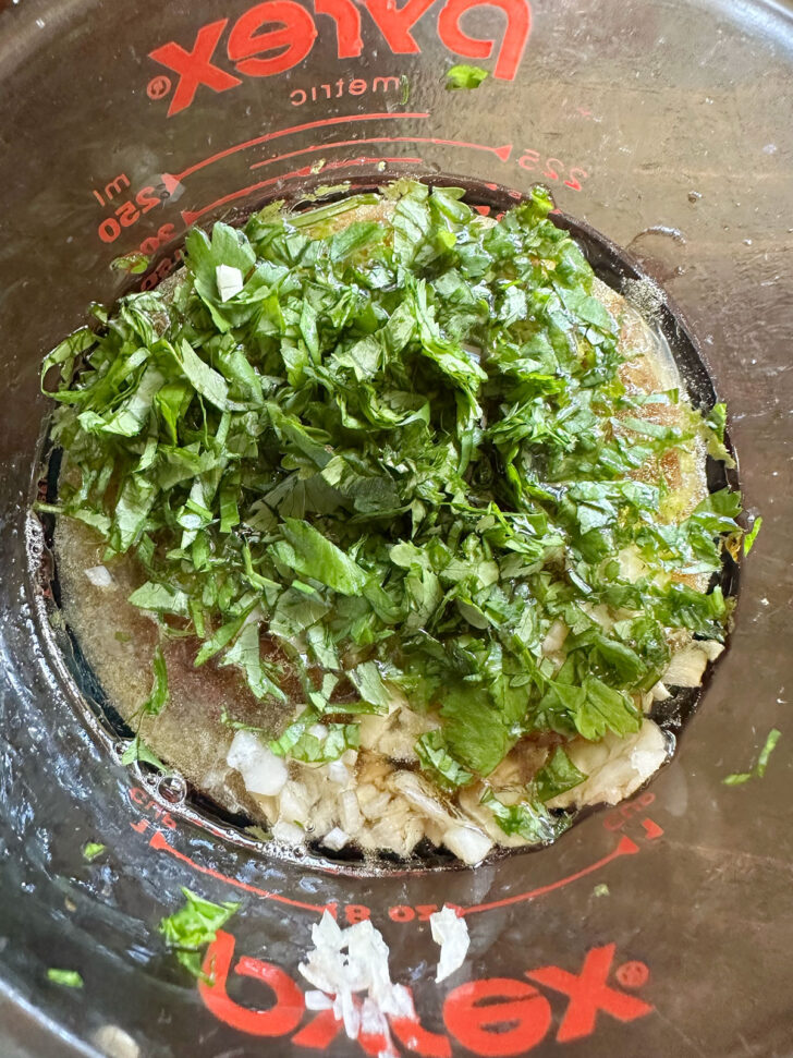 Vietnamese chicken marinade ingredients in a measuring cup.