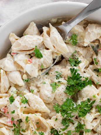 Shell pasta salad in a serving bowl.