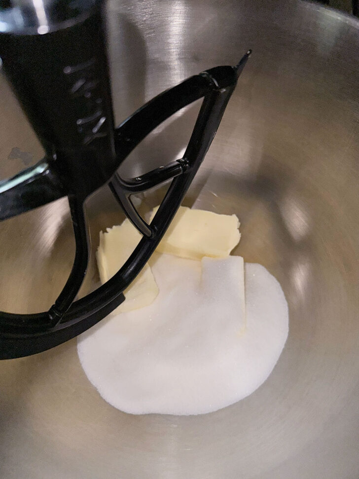 Butter and white sugar in the stand mixer bowl.