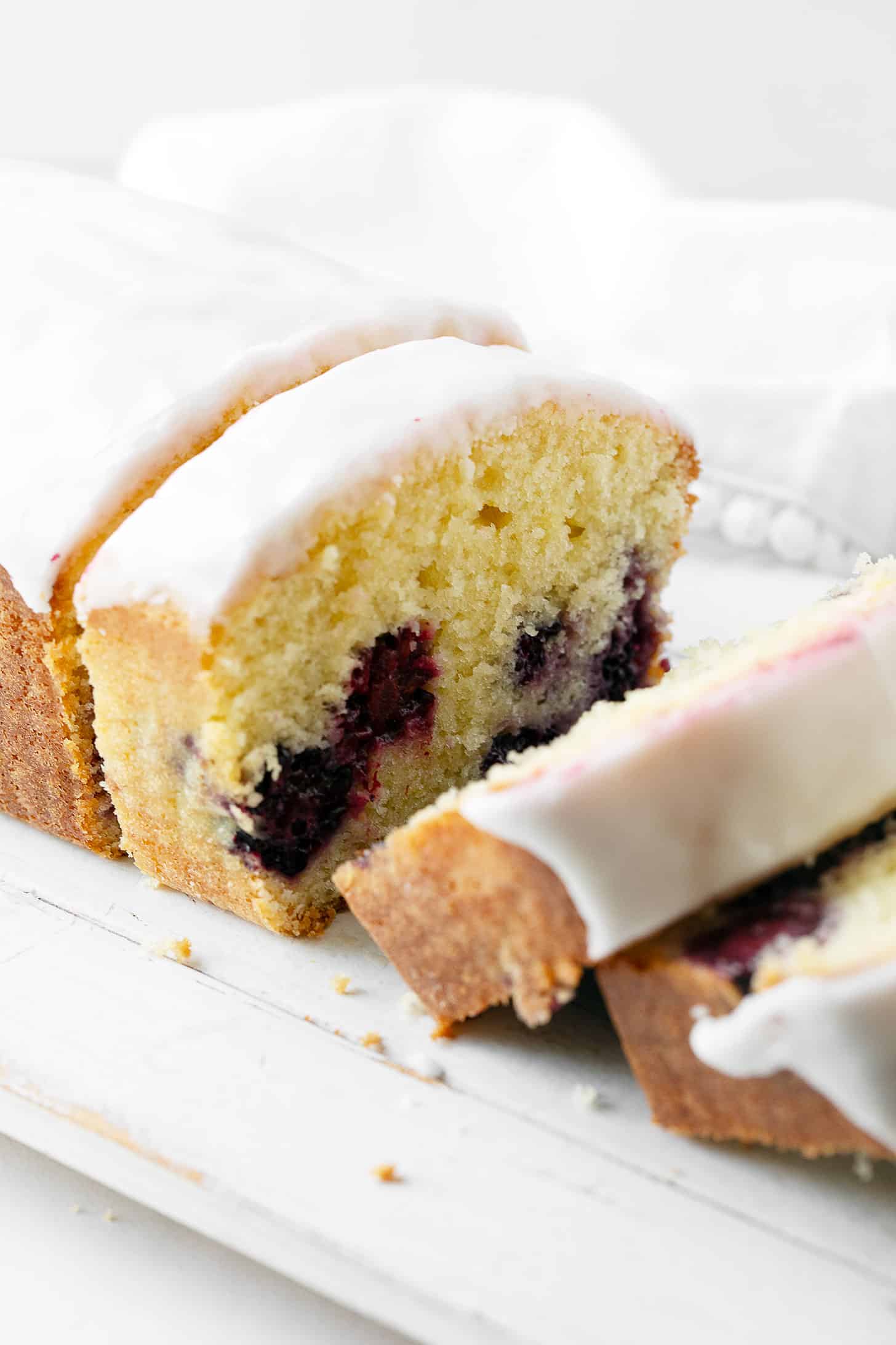 Lemon blackberry bread thinly slices the cutting board.